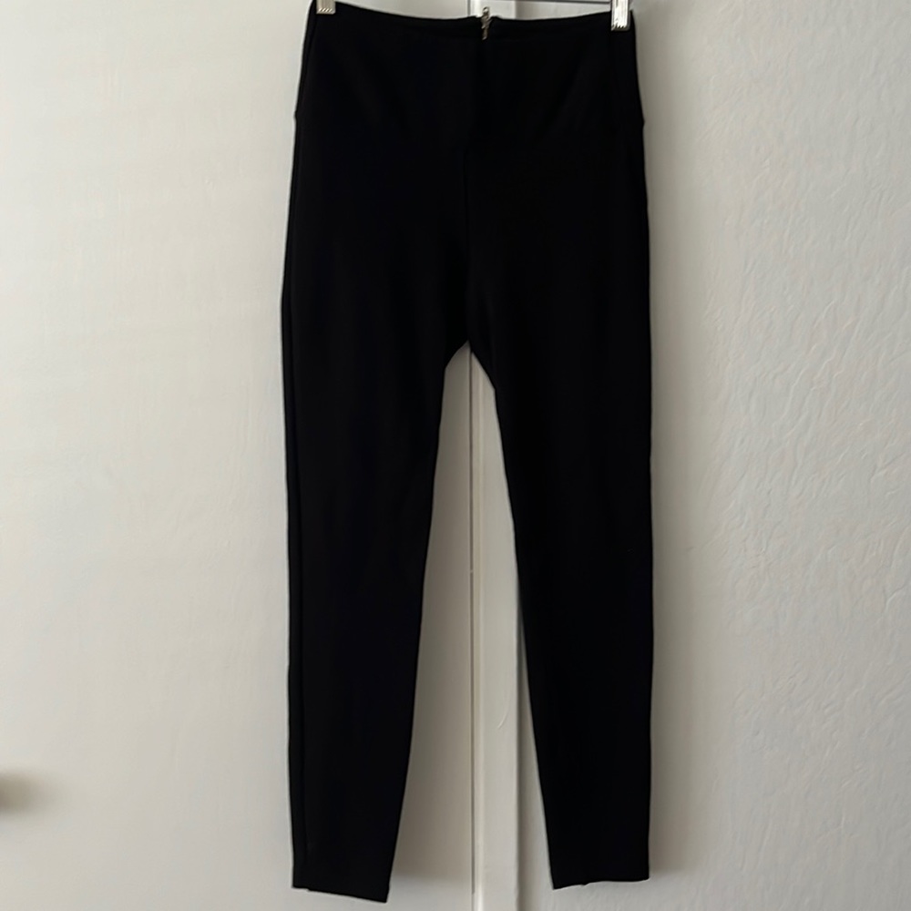 Black Bebe leggings with zipper in back